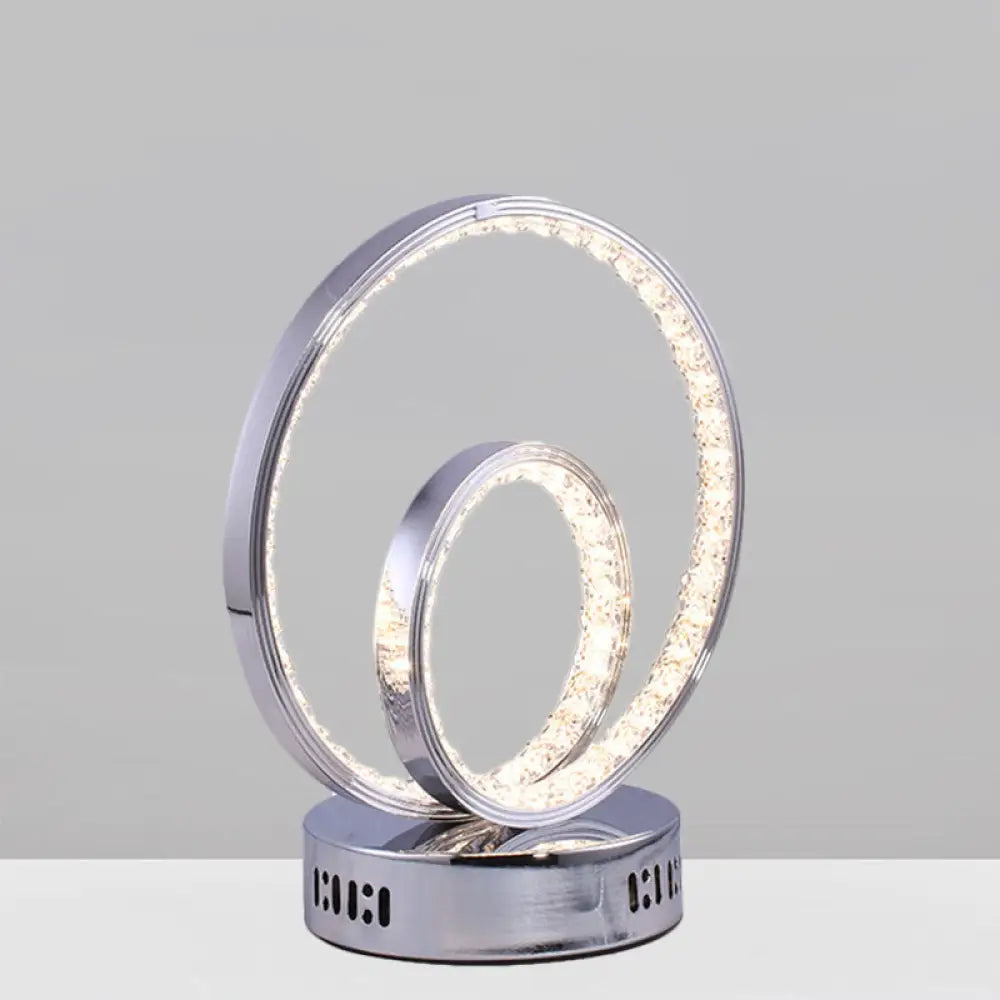 glass table lamps with a frosted surface for soft light diffusionglass table lamps with a frosted surface for soft light diffusionModern Minimalist Circle Nightstand Lamp: Metallic LED Task Lighting in Chrome - Perfect for Study Rooms