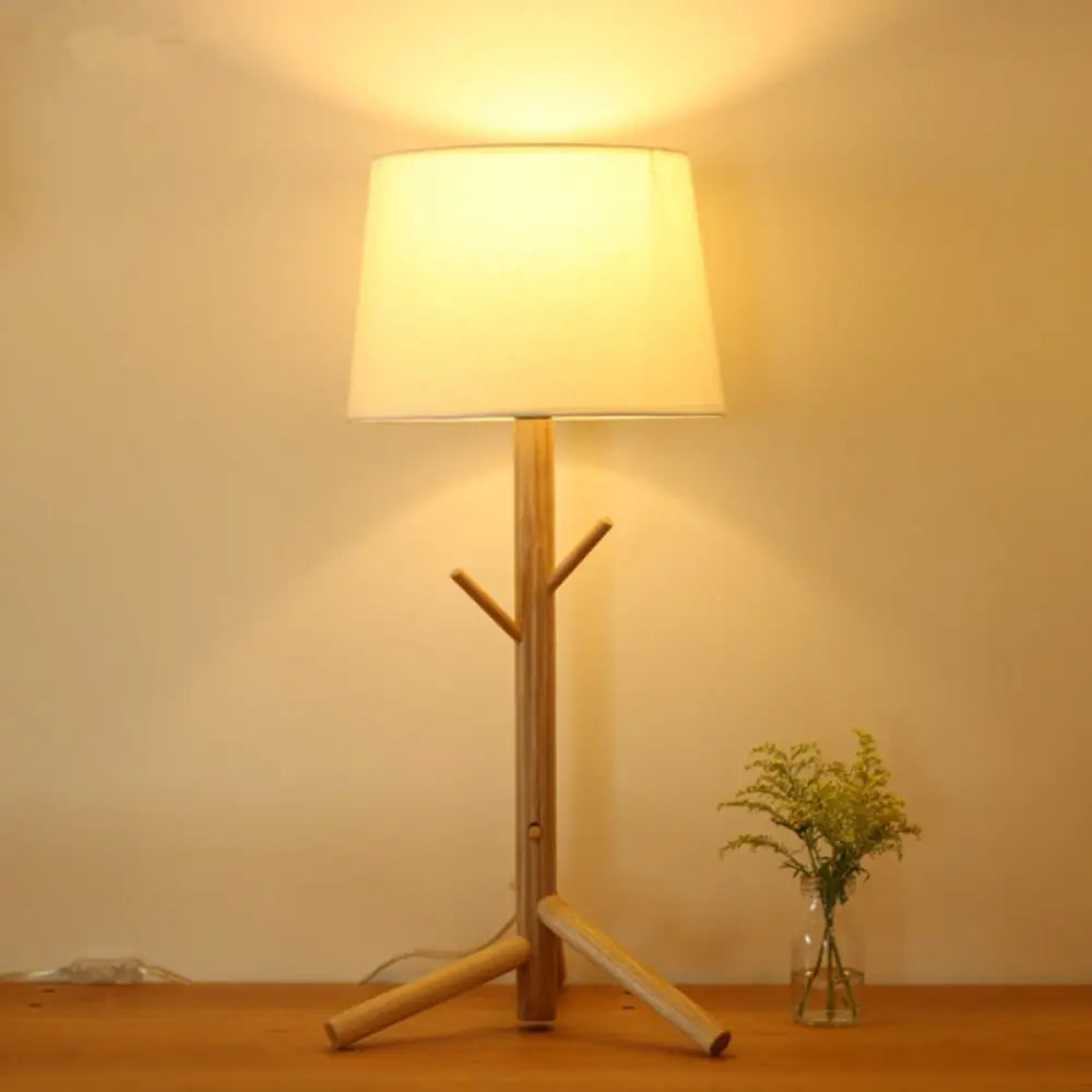 wooden table lamps with natural grain for a warm and organic feelwooden table lamps with natural grain for a warm and organic feelNordic Tree Branch Nightstand Light - Tapered Drum Table Lamp with Wood Rack
